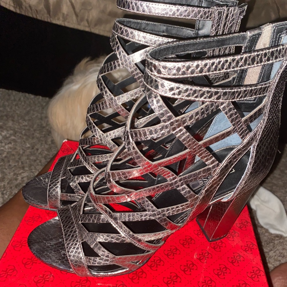 Silver heels worn twice, zipper on the back of shoes